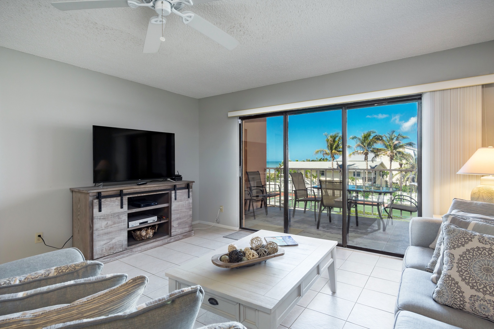 Beautiful blue skies and palm trees viewed from the living room.