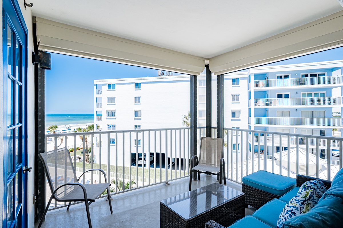 Settle into your private balcony and soak up serene ocean breezes with a glimpse of turquoise waters just beyond. Comfortable seating and a glass-top table make this the perfect spot to start your mornings or unwind after a beach day.