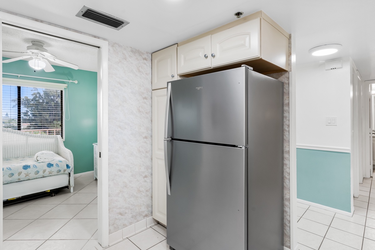 Your fully equipped kitchen features stainless steel appliances and custom cabinetry, perfect for preparing meals during your stay.