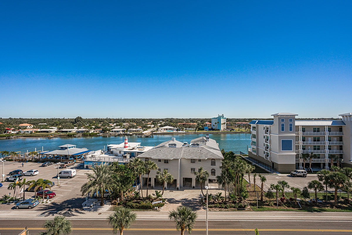 Waterfront property featuring marina access, tropical landscaping, and modern accommodations with scenic bay views.