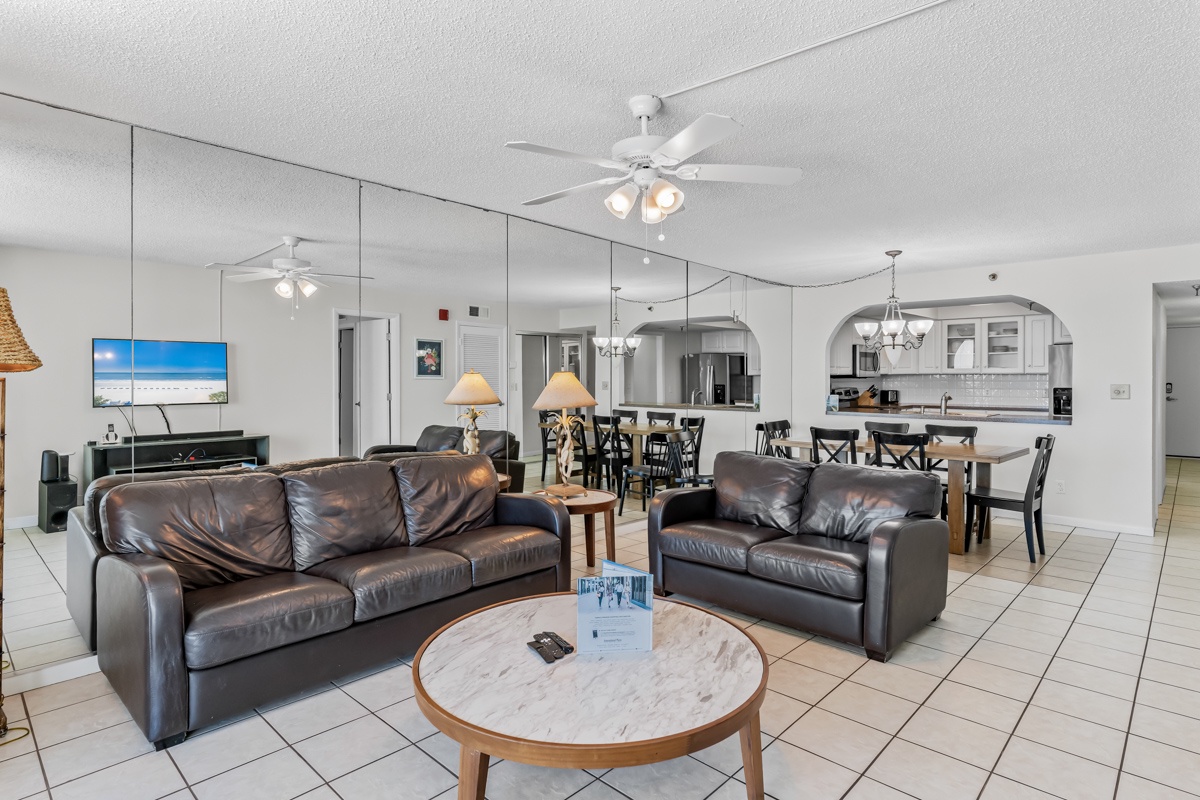 Relax in your spacious open-plan living area with comfortable leather seating, perfect for unwinding after beach days.