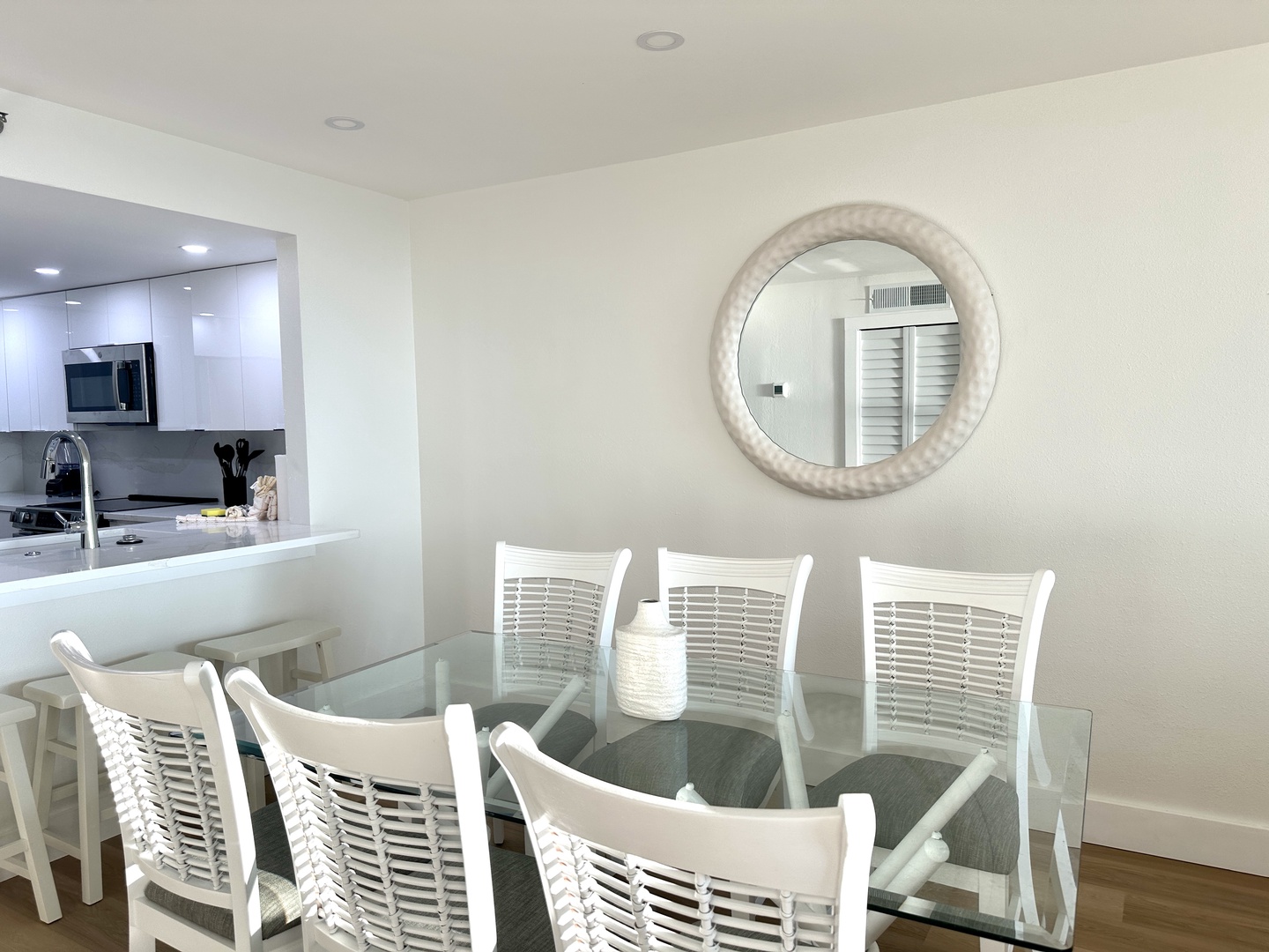 Gather around your elegant glass dining table for six, perfectly positioned next to your open-concept kitchen for effortless meal prep.