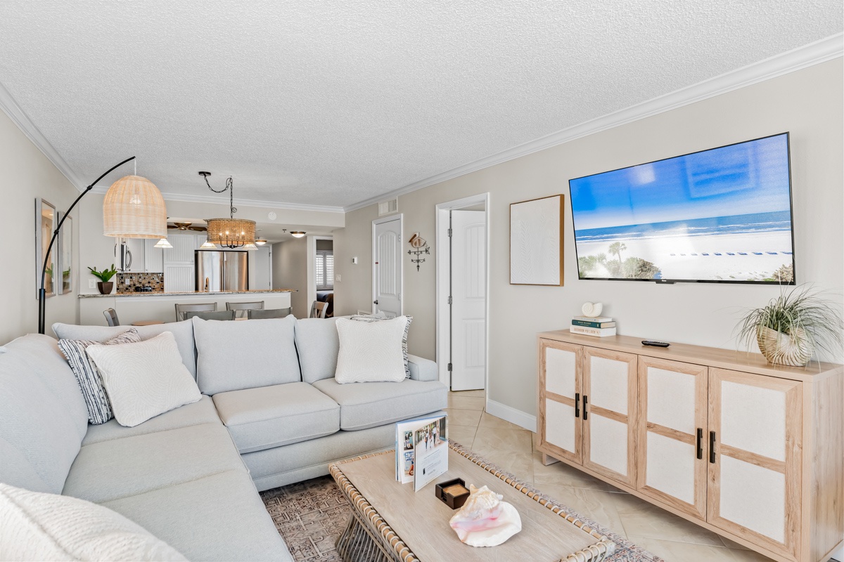 Sink into plush sectional seating while enjoying beach views on the large TV in your bright, open-plan living space.