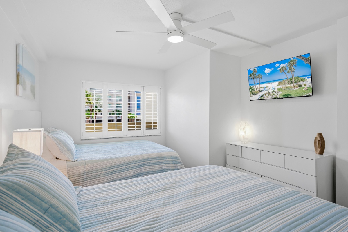 Wake up refreshed in your bright 2 Queen bedroom, with coastal breezes from the ceiling fan and morning light through plantation shutters.