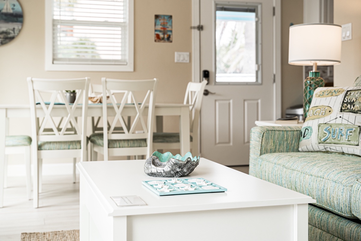 Your bright, coastal-themed living space blends comfort with beachy charm—perfect for relaxing after sun-soaked days.