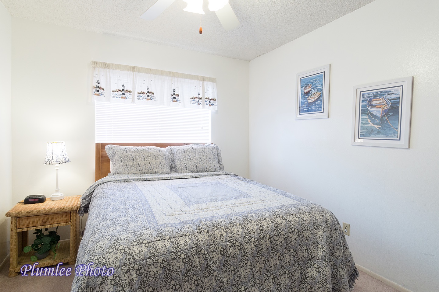 The Third Bedroom has a queen size bed and an overhead fan.