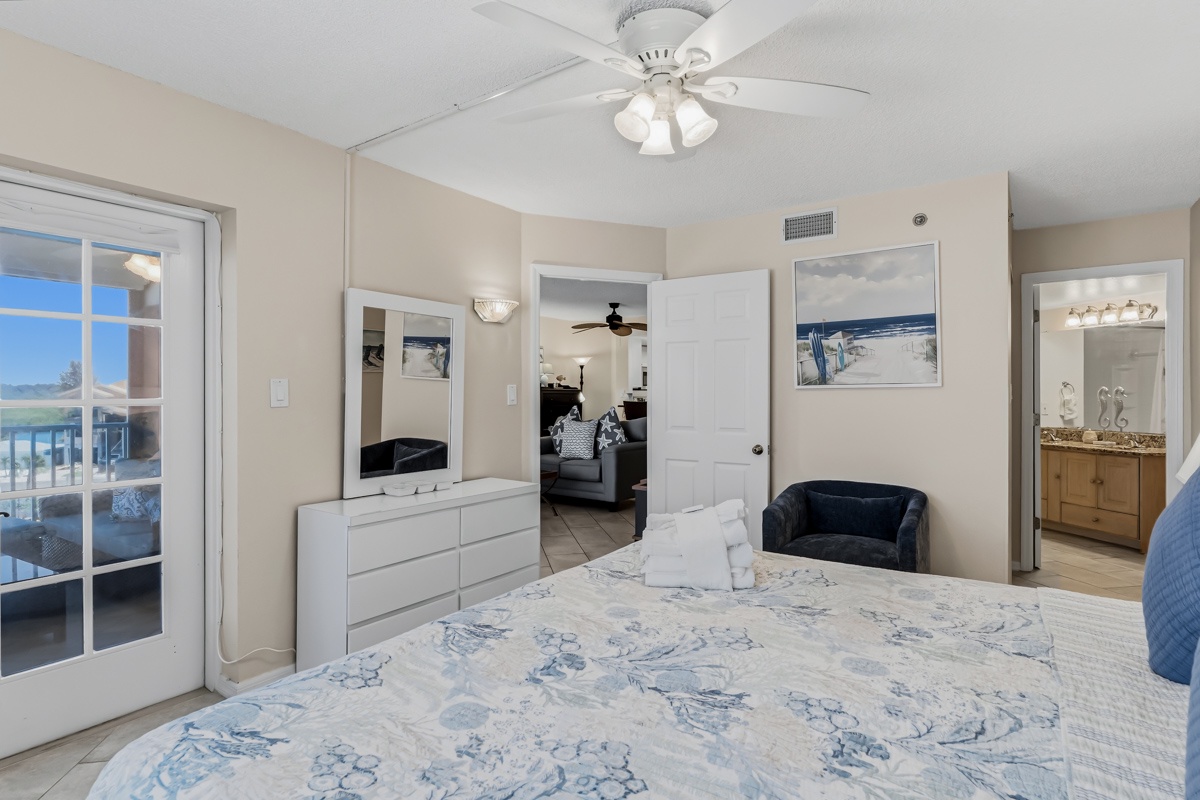 Relax in your comfortable bedroom, styled with coastal accents and soft ocean-inspired linens. Step through the glass door to your private balcony and let the gentle breeze invite you into tranquil vacation mode.