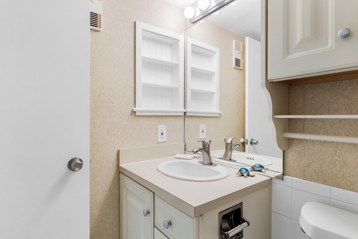 Your private bathroom features a convenient vanity with mirror, perfect for your daily routine.