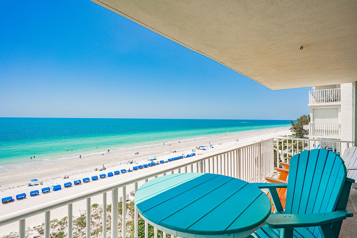 Sink into your private balcony chair and watch endless turquoise waves meet pristine white sand stretching beyond the horizon.