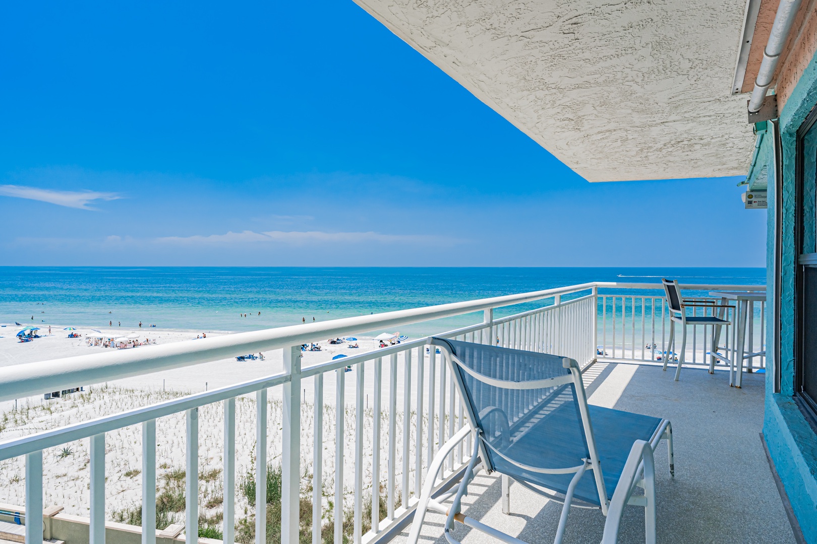 Your private beachfront balcony awaits, offering sweeping ocean views and direct access to sugar-white sands. Relax in coastal comfort with your morning coffee or evening breeze just steps from the waves.