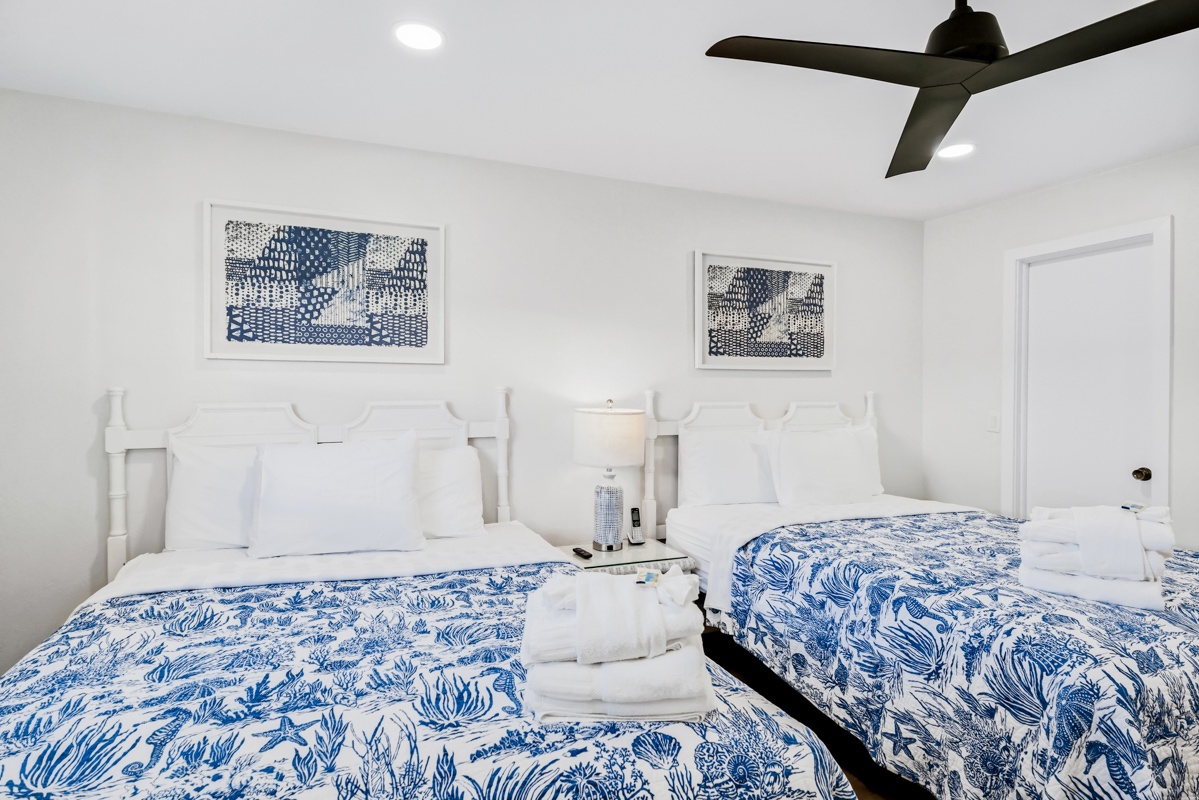 Drift into peaceful sleep in your bright 2 Queen bedroom, where crisp linens and coastal-inspired decor create the perfect seaside retreat.