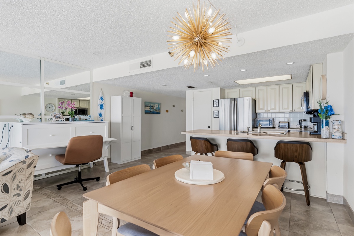 Gather with loved ones in this bright, airy space where the kitchen, dining, and living areas flow seamlessly together. The white cabinet/desk opens up to a Queen size memory foam murphy bed.