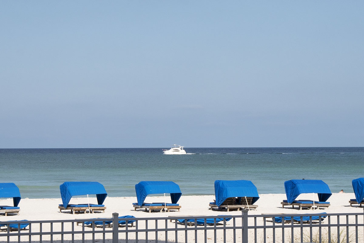 Cabanas on the beach by Sand Castle I are available to rent.