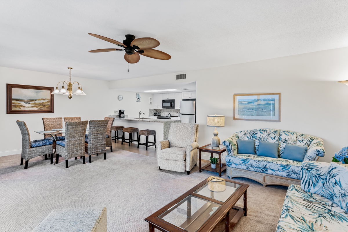 Relax in your bright open-concept space where tropical blues meet coastal comfort, perfect for unwinding after beach days.