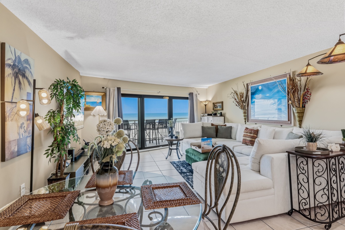 Picture your mornings here: sunlight streaming through the sliding glass doors, ocean breezes, and a cozy living space that invites you to unwind by the sea.