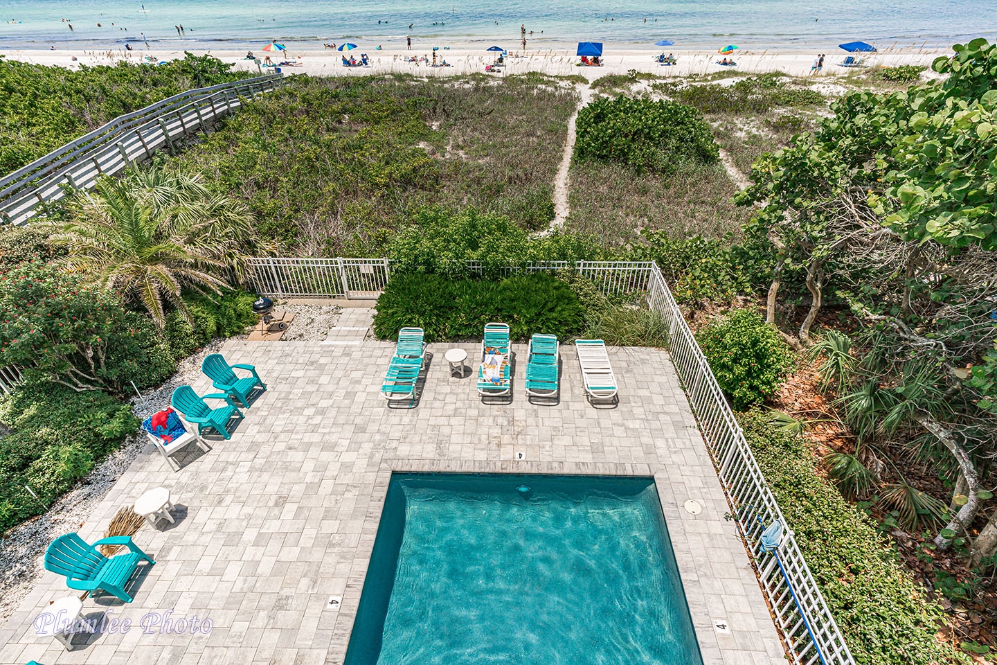 The pool and pool deck as seen from the balcony.