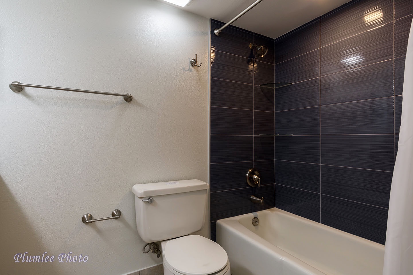 The Hallway Bathroom has a tub and shower combo.