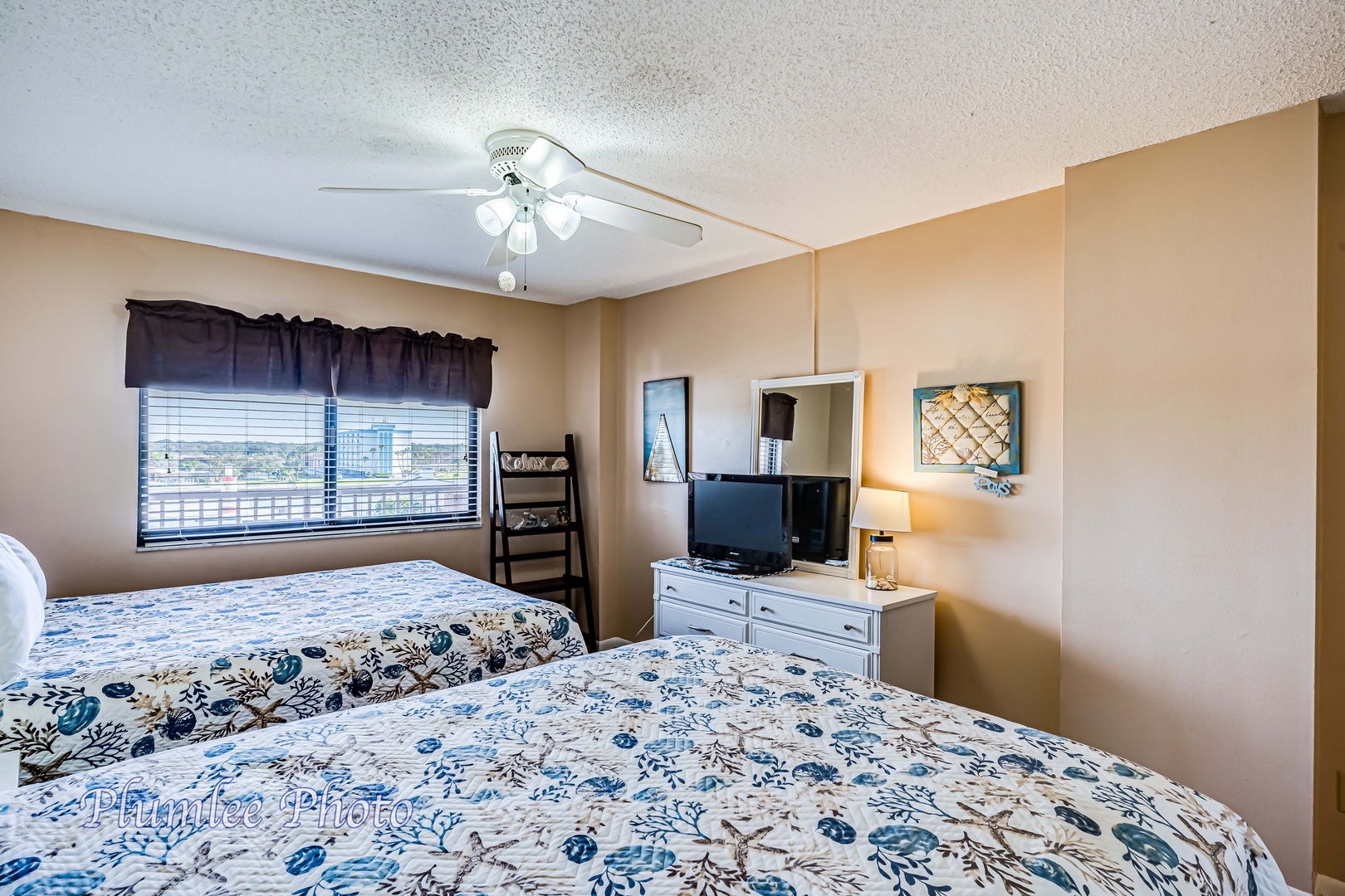 Intracoastal view with ceiling fan and TV