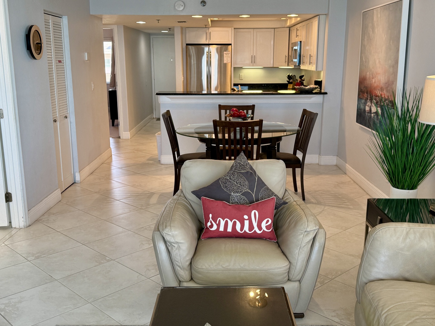 Sink into plush leather seating where your modern kitchen awaits with granite counters and stainless appliances for memorable meals together.