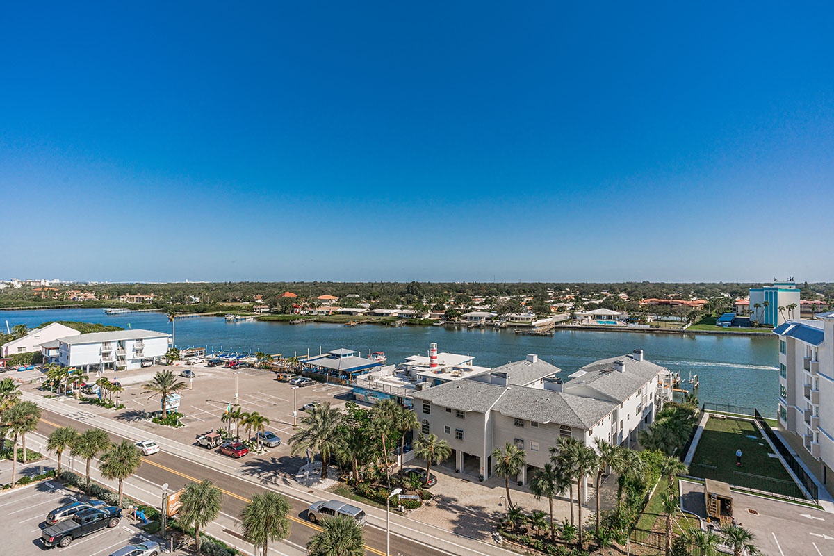 Aerial view showcasing the property's prime waterfront location with marina access and tropical coastal surroundings.
