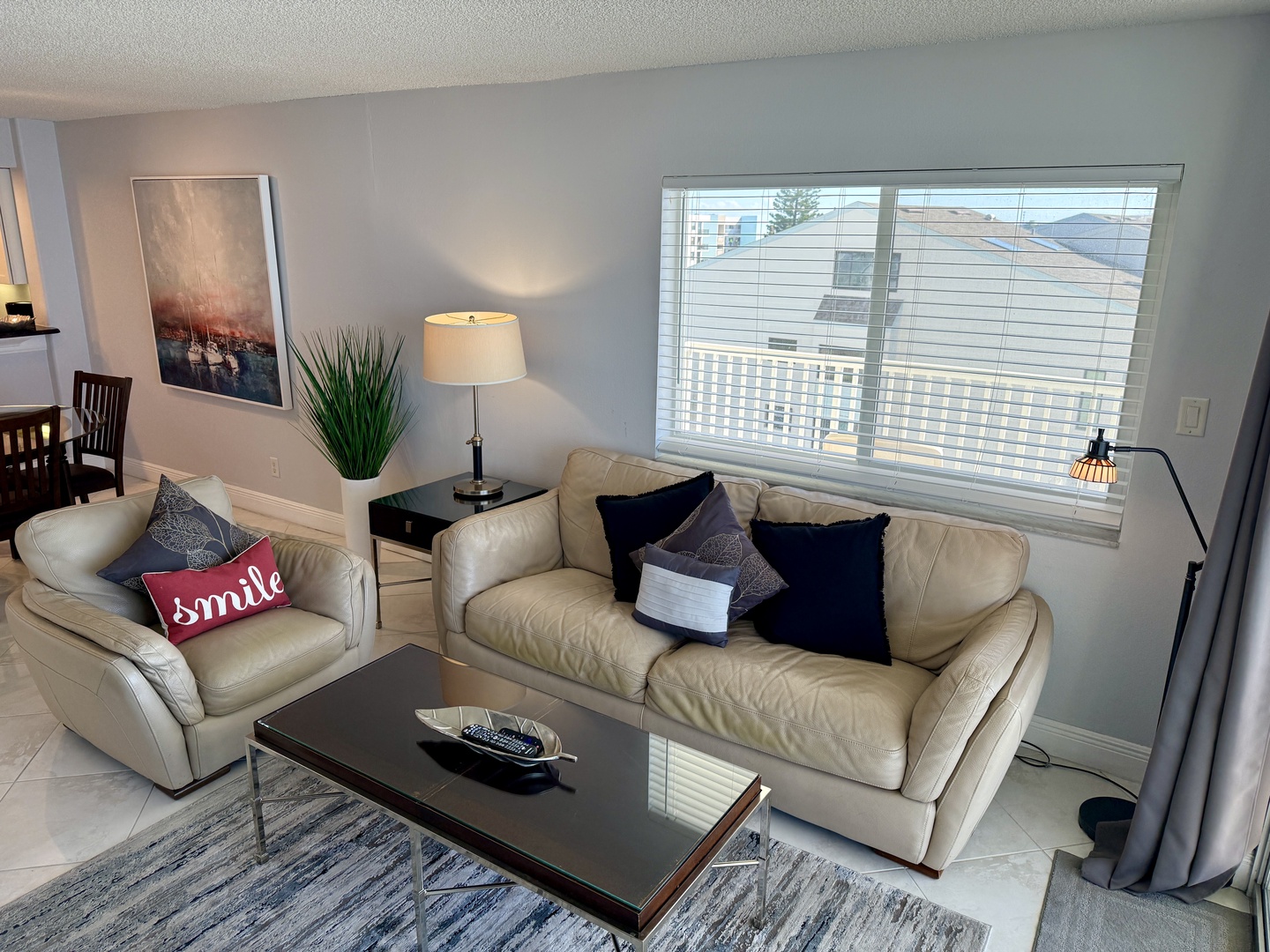 Unwind in your stylish living room with plush leather seating, warm lighting, and thoughtful touches that make you feel right at home.