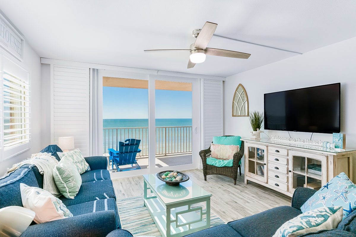 Relax in your coastal living room with panoramic ocean views and cool sea breezes flowing through your private balcony.