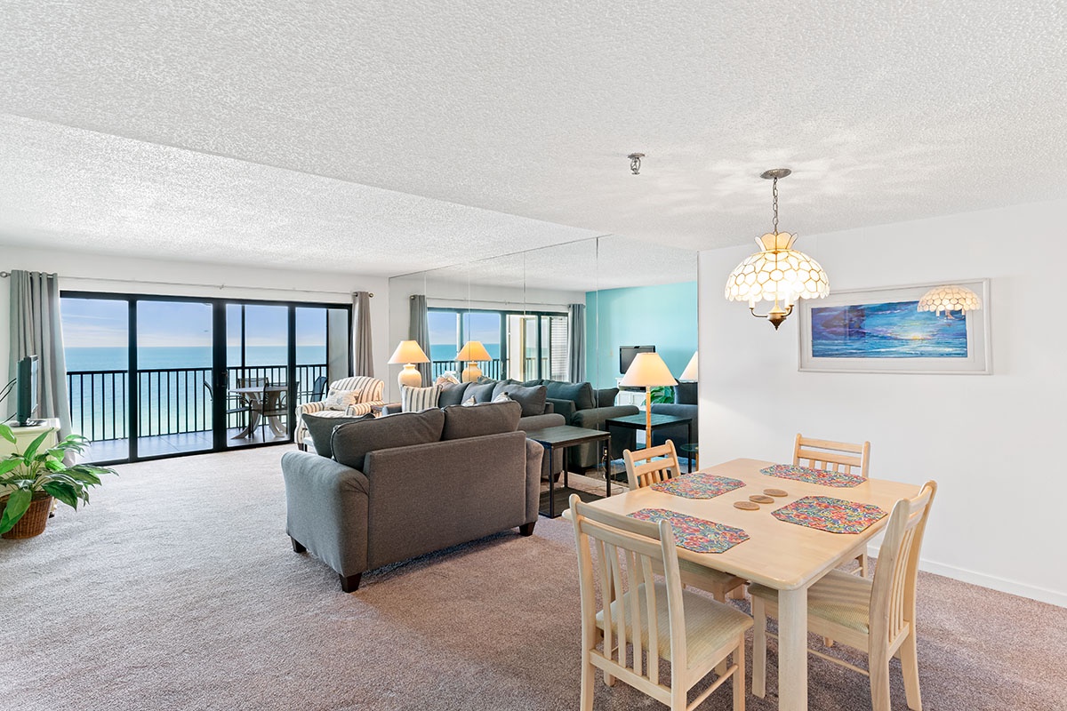 Relax in your bright oceanfront living space where floor-to-ceiling windows frame endless sea views from your private balcony.