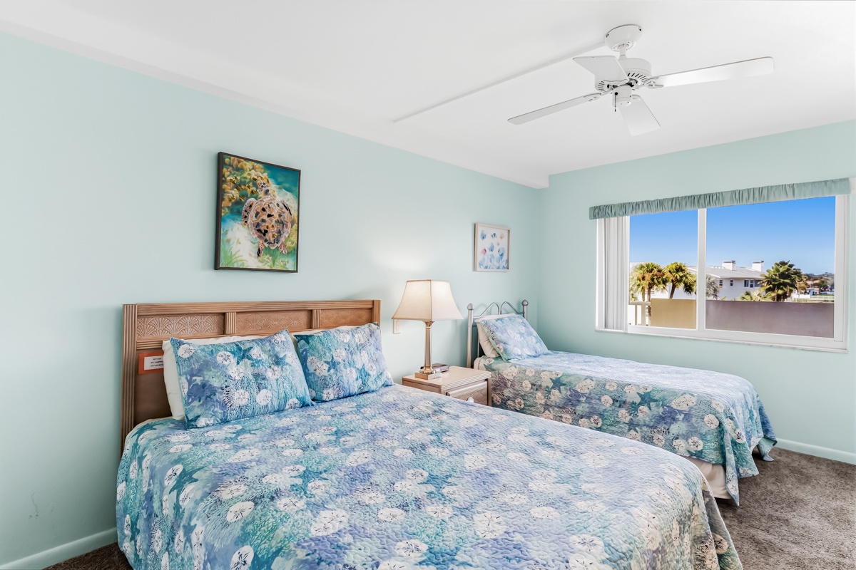 Drift off to sleep in your serene coastal bedroom, with Queen and Twin beds, where gentle sea breezes and palm-framed views greet you each morning. Two comfortable beds ensure everyone rests well after days of beachside adventure.