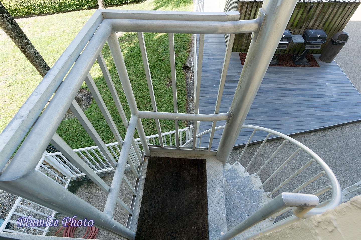 Private spiral staircase down to pool area