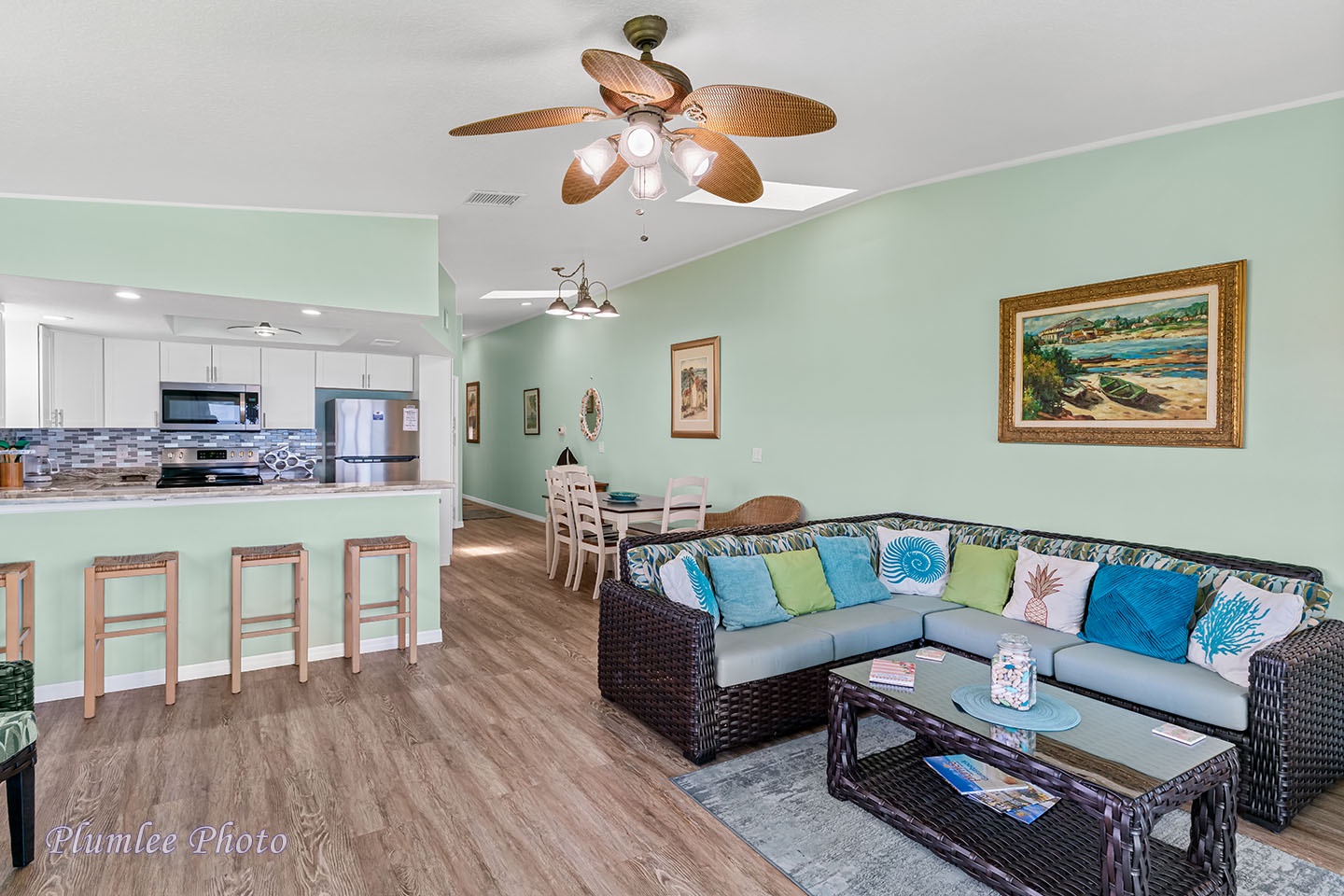 Open layout of the living room, dining area, and kitchen.