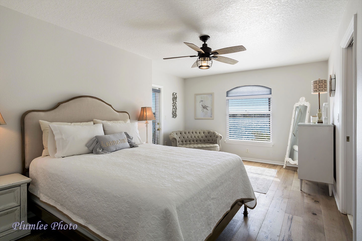 Bedroom 2 has a queen size bed and a sitting area.