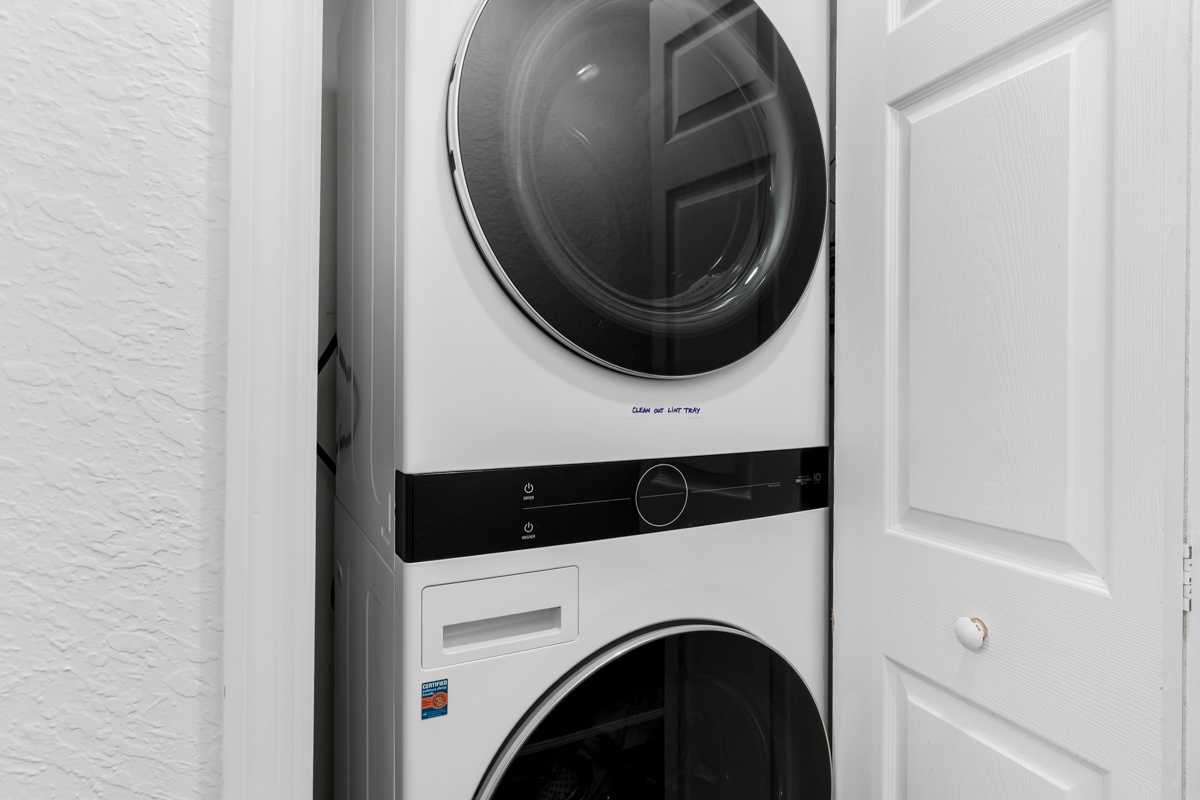 Your in-unit washer and dryer make extended stays effortless, tucked away in this convenient closet space for easy access whenever needed.