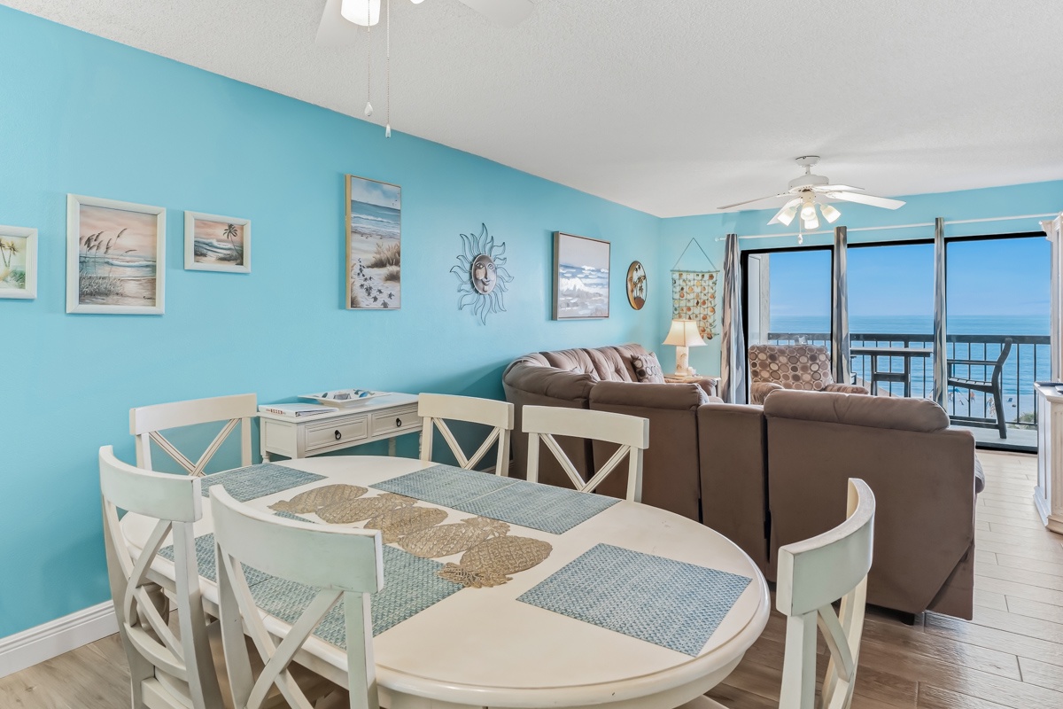 Relax in your airy coastal retreat, where ocean breezes drift through open doors and sparkling blue waters frame every moment. Unwind on plush seating or gather around the cheerful dining table for meals with a view.