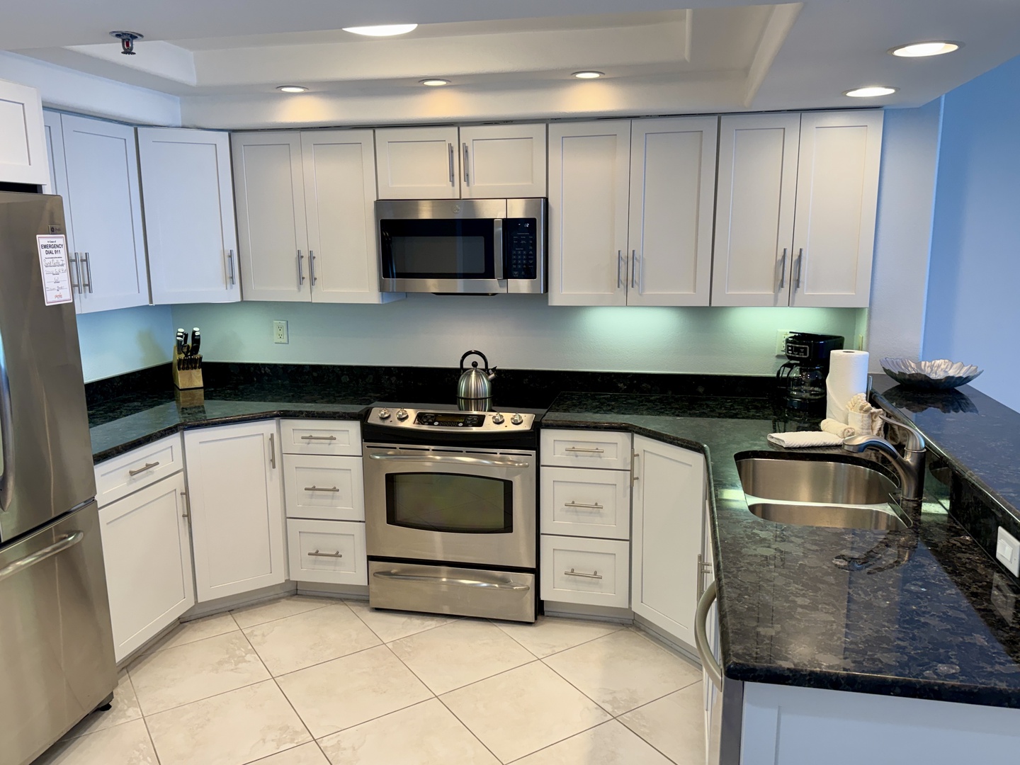 Your fully equipped kitchen awaits with stainless steel appliances, granite countertops, and soft under-cabinet lighting for effortless meal preparation.