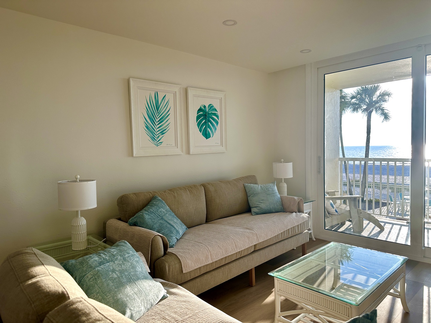 Sink into plush seating with tropical artwork setting the mood for your oceanfront escape, where turquoise accents mirror the endless sea beyond your private balcony.