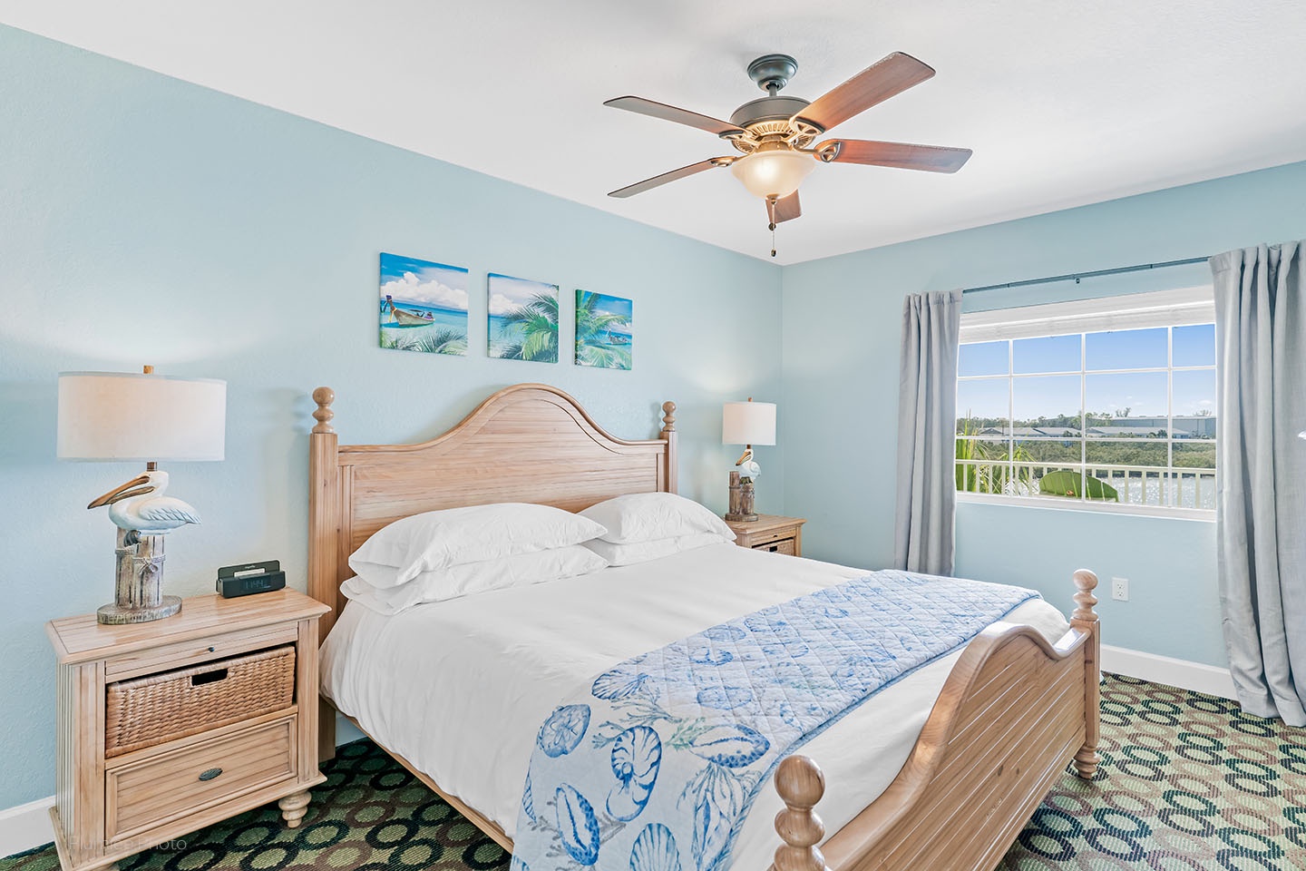 King bed in master bedroom with water view