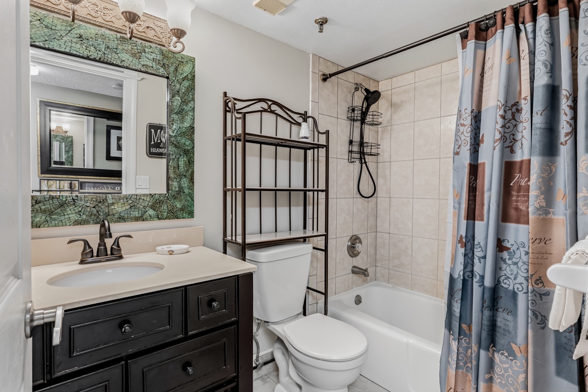 Step into your private bathroom with stylish tile, a tub-shower combo, and convenient storage for all your essentials.