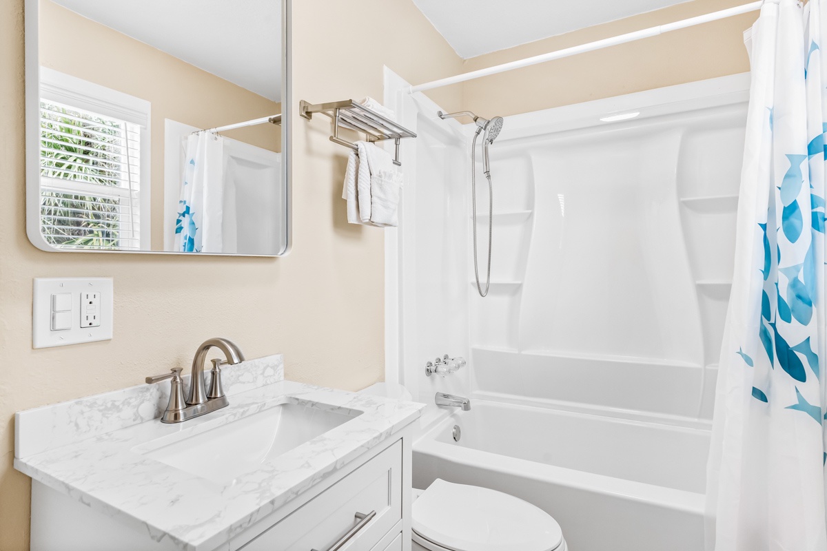 Refresh in your bright, clean bathroom with marble counters, deep soaking tub, and modern fixtures designed for your comfort.