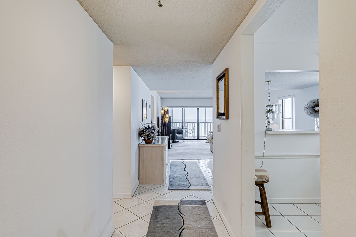 Step into your bright, airy home with stylish tile floors and modern touches welcoming you throughout.