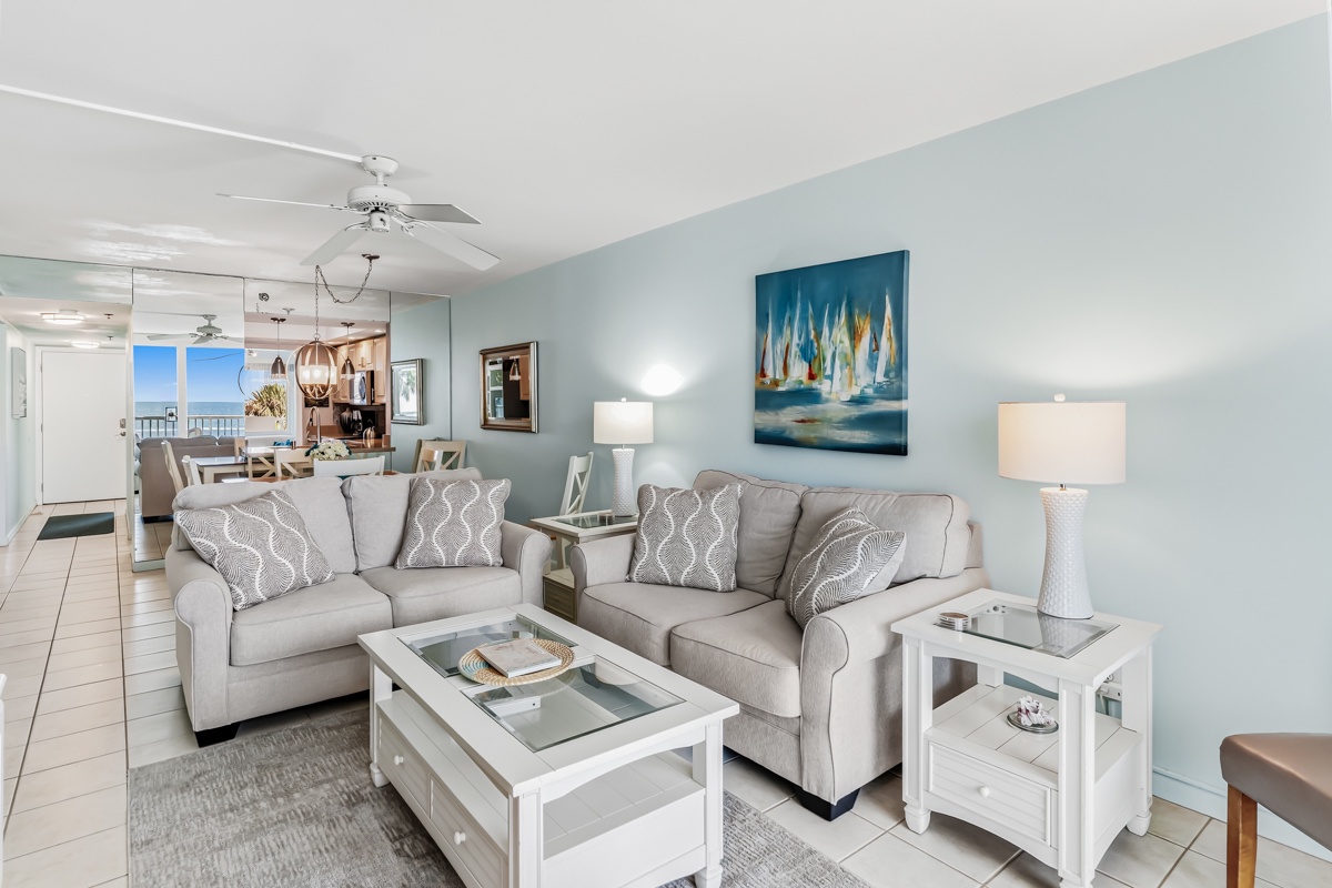 Sink into cozy sofas and unwind in your bright, beach-inspired living space. Soothing coastal colors and beachy decor set the tone, while glimpses of the ocean beyond invite you to relax and let vacation mode take over.