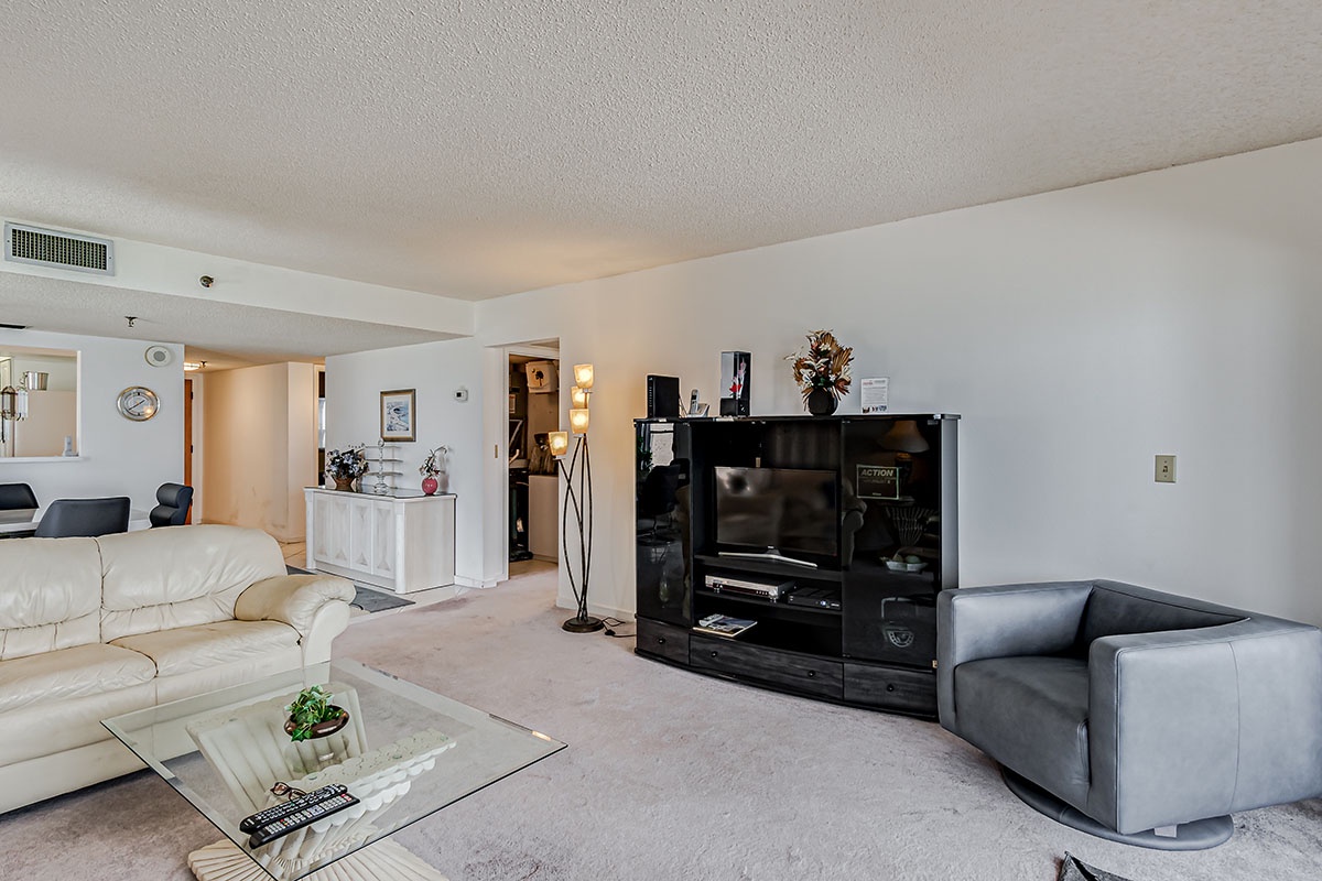 Relax in your spacious living area with plush seating, entertainment center, and open-concept design perfect for unwinding after exploring.