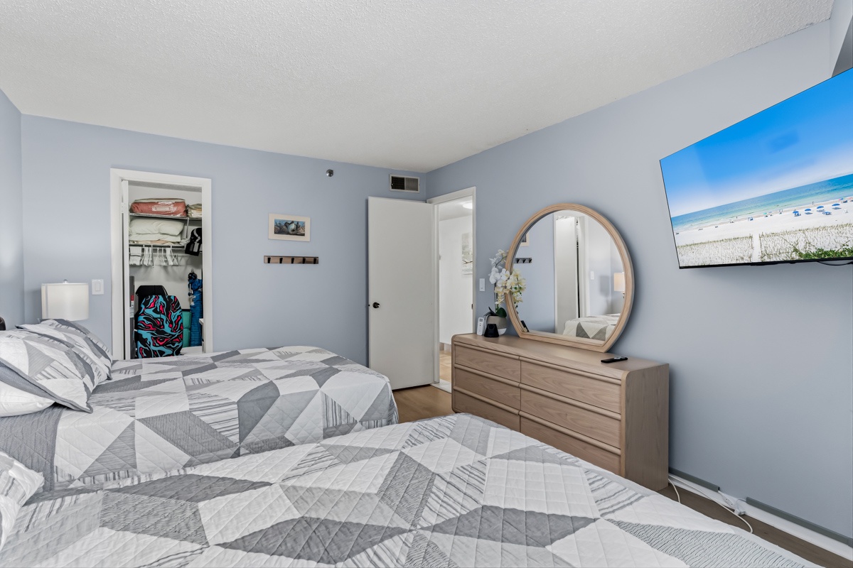 Sink into soft bedding and wake up refreshed in your peaceful bedroom retreat, complete with charming coastal touches and plenty of storage for your belongings.