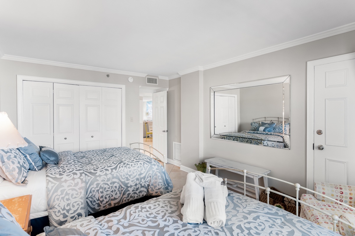 Rest peacefully in your bright bedroom with comfortable double beds, ample storage, and air conditioning for your perfect temperature.