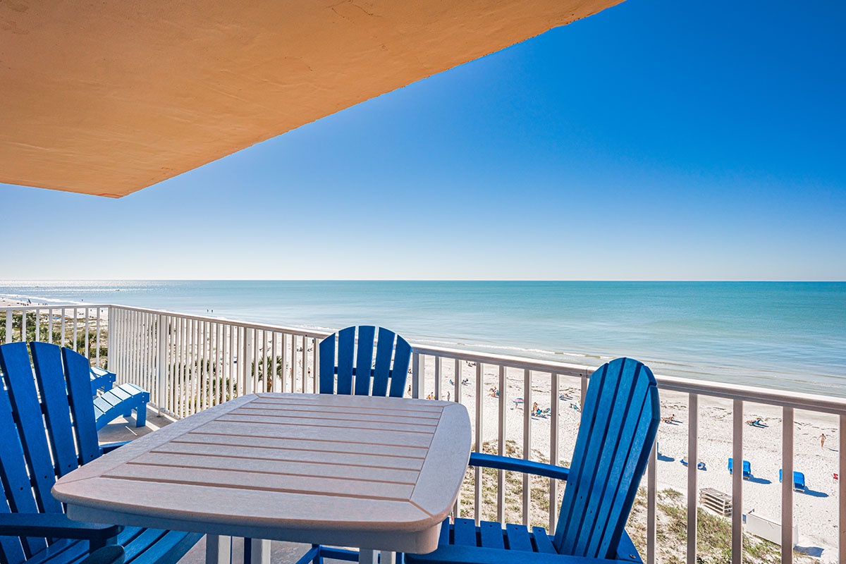 Sip your morning coffee at your private balcony table while ocean waves gently roll onto pristine sand below.