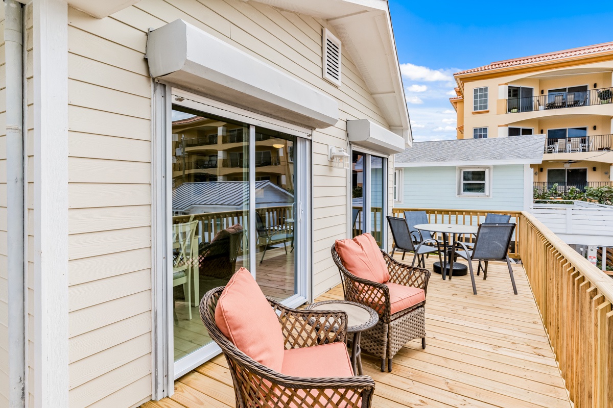 Relax on your private deck with cozy seating and dining space, perfect for morning coffee or evening gatherings under the open sky.
