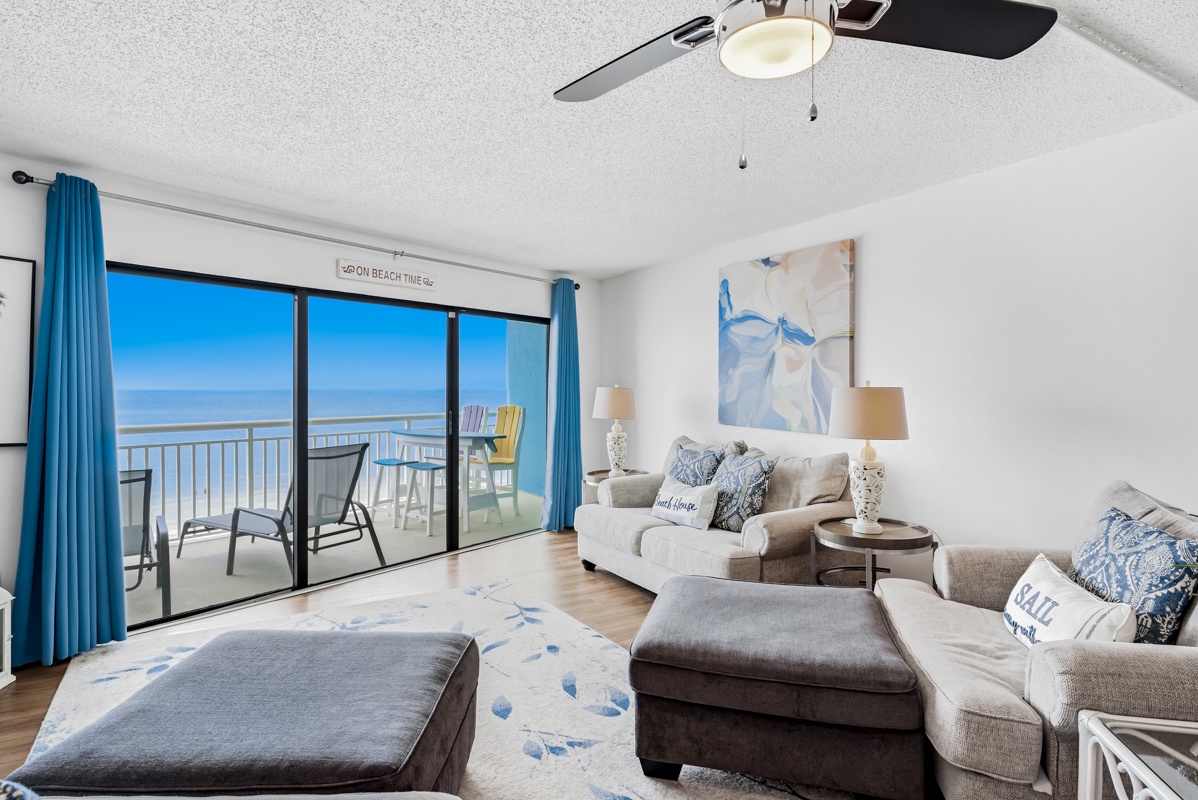 Sink into your coastal living room where ocean blues meet comfort, with stunning sea views just beyond your private balcony.