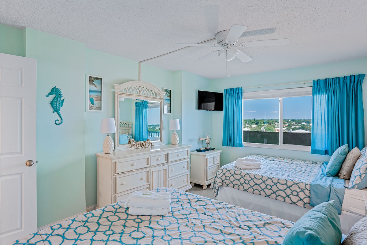 Drift off to sleep in your coastal retreat where ocean breezes flow through bright windows and turquoise touches create pure seaside serenity.