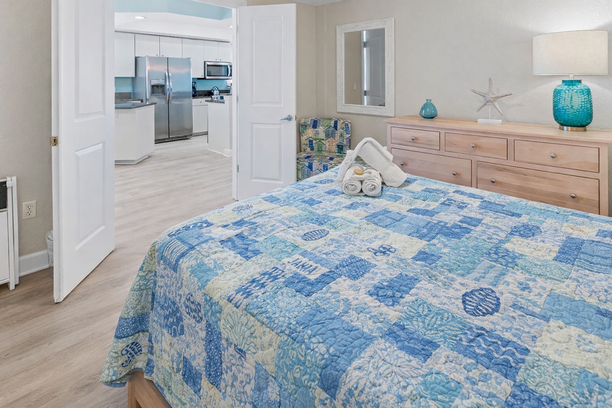 Drift off in your coastal bedroom with ocean-inspired decor and soft linens, steps from your fully equipped kitchen.
