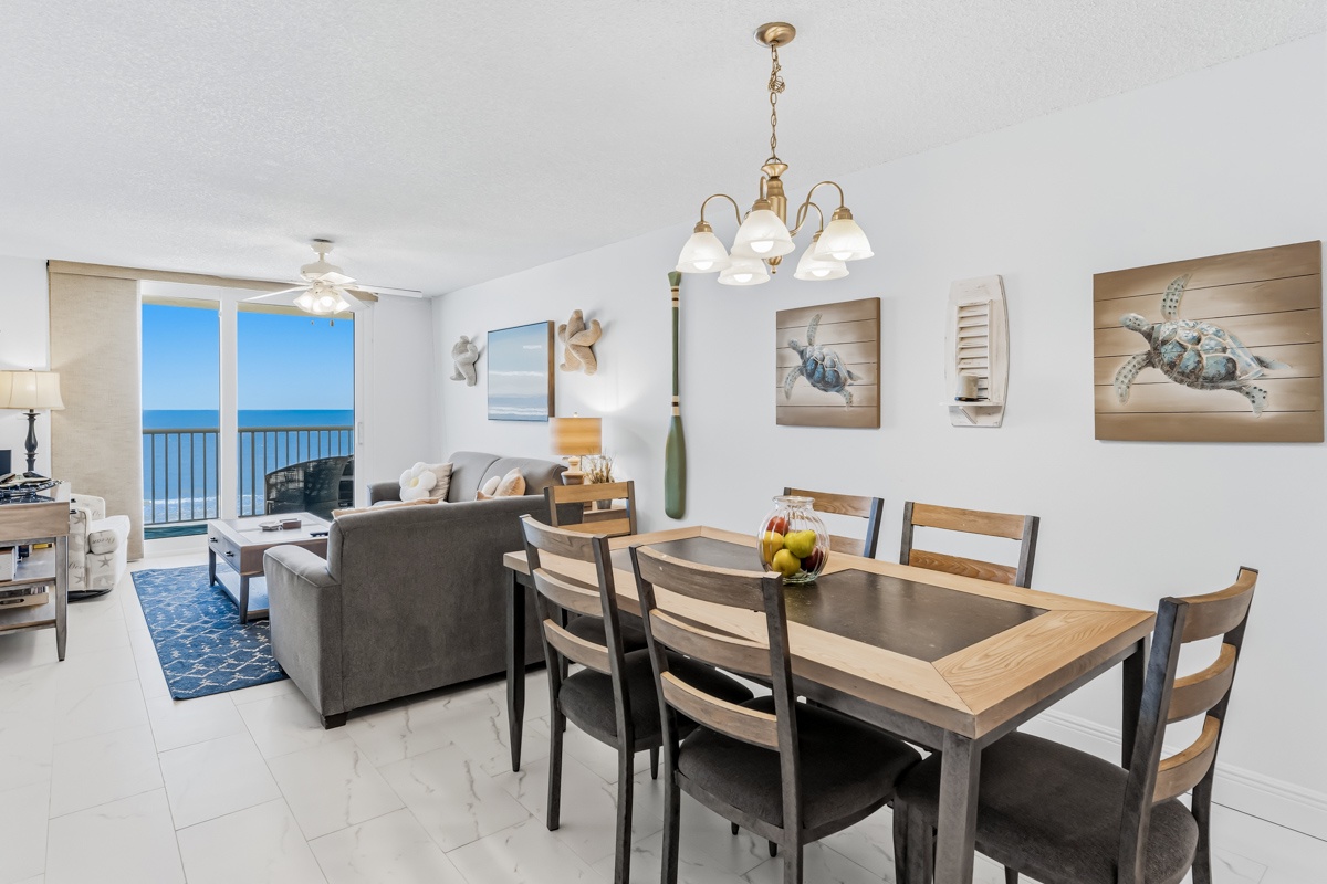 Your elegant dining space flows into the living area, with stunning ocean views creating the perfect backdrop for memorable meals together.