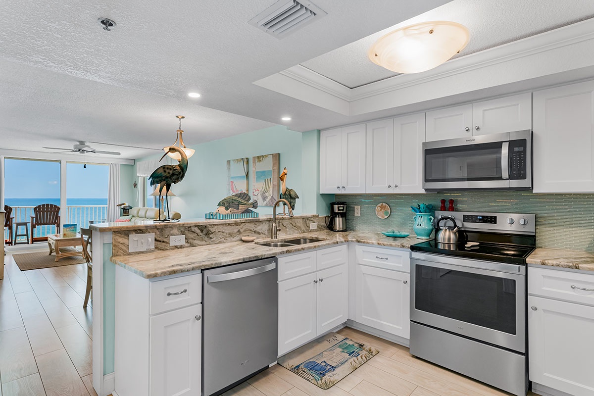 Craft your perfect vacation meals in this bright, fully-equipped kitchen with ocean views beckoning through the windows.